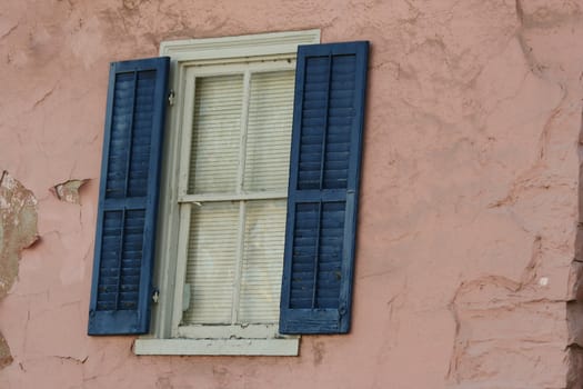 A old window with blue shutters
