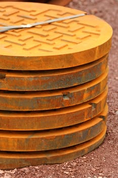 A stack of manhole covers