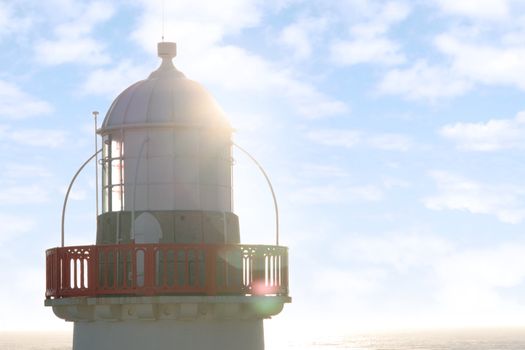 lighthouse captured with the sun behind it