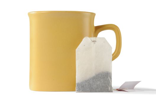 isolated cup and teabag with clipping paths