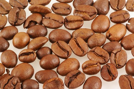 Fresh roasted coffee beans background.             