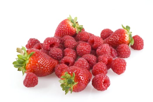Bunch of strawberries and raspberries isolated on white.