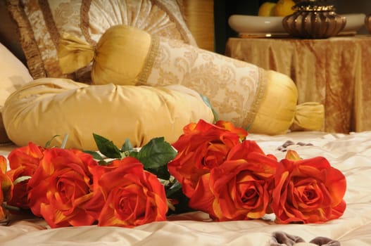 red roses on a bed 