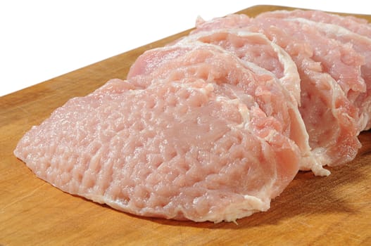 removed and cut raw undercut of pork