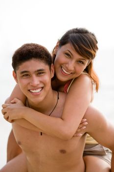 young couple having fun at the beach