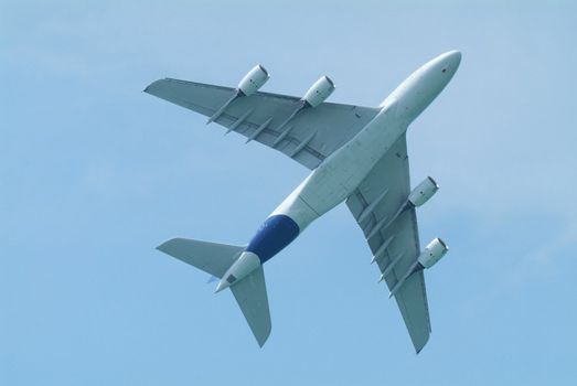Wide-body airliner flying seen from below