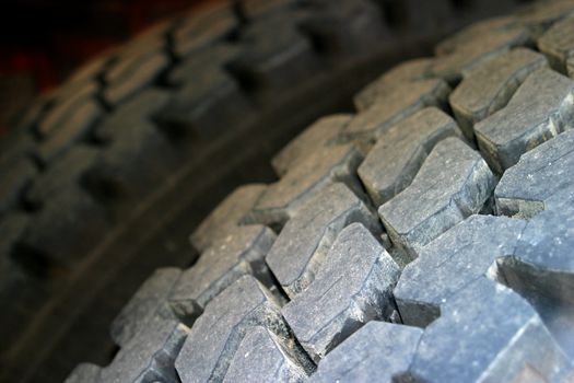 Two tires from a large truck as a close-up shot.