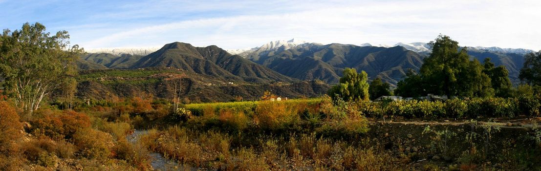 Landscape shot of the Ojai valley with snow on the mountains.