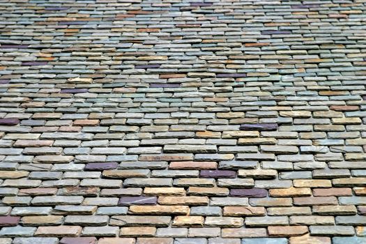Colorful stone roof tiles from below