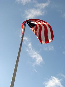 American Flag v1 with Red White and Blue colors set against a blue sky with white clouds.