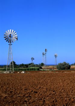 Irrigation windmills pumping water for farmland in Cyprus