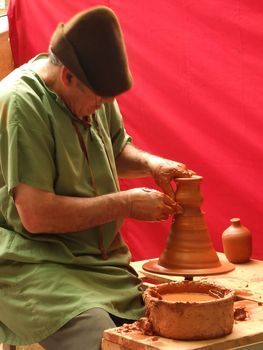 Old men doing a clay pottery