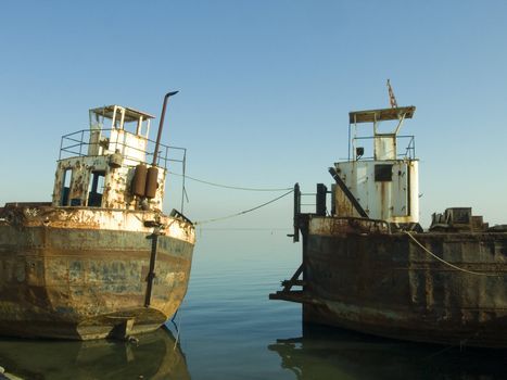 abondon old rusty ships in the coast line