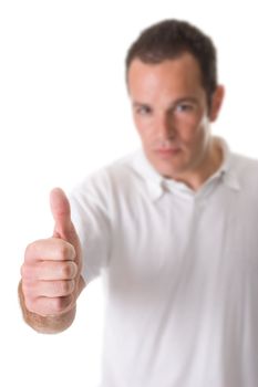 A young man showing thumbs up. Focus on hand. White background.