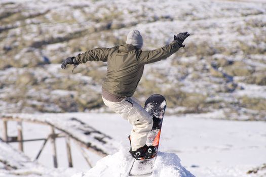 Men jumping on a snowboard