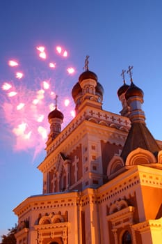 Celebratory fireworks behind chirch