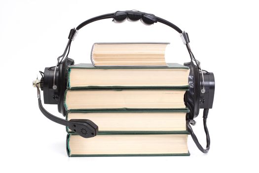 audiobook conception with headphones and books