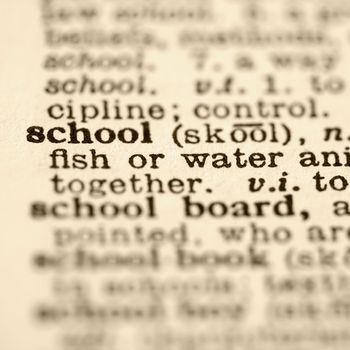 Selective focus of dictionary definition for the word school.