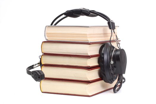 audiobook conception with headphones and books