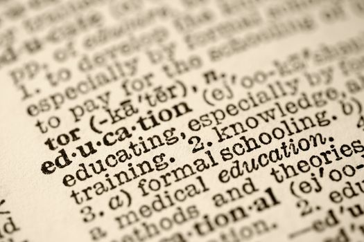 Selective focus of dictionary entry for the word education.