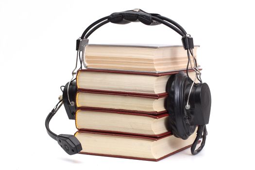 audiobook conception with headphones and books
