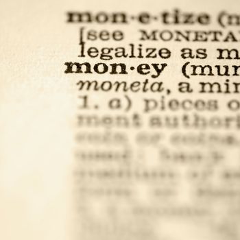 Selective focus of dictionary definition for the word money.