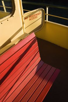 Bench on ferryboat with access entry in Sydney, Australia.
