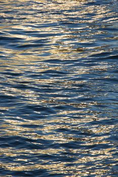 Sunlight reflecting on waves in water.