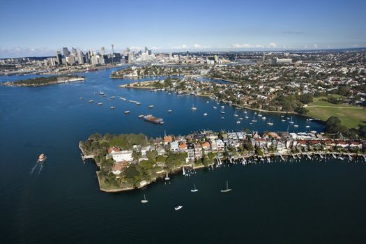 Aerial view of boats in Snails Bay with view of downtown skyline in Sydney, Australia.