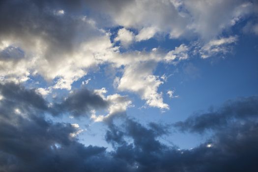 Cumulus clouds in blue sky.