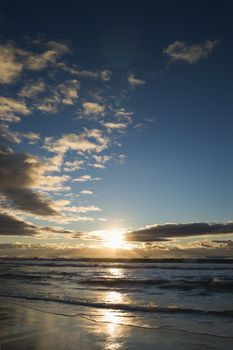 Cumulus clouds at sunset over ocean in Surfers Paradise, Australia.