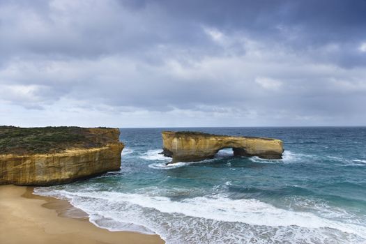 Rock formation in arch shape as seen from Great Ocean Road in Australia.