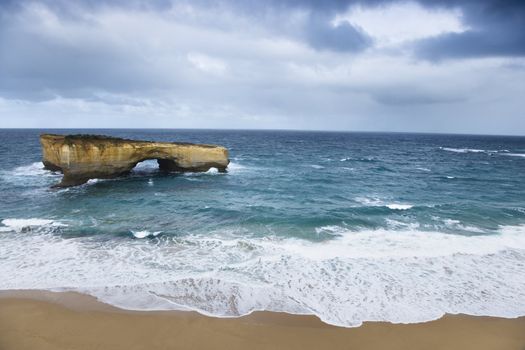 Rock formation in arch shape as seen from Great Ocean Road in Australia.