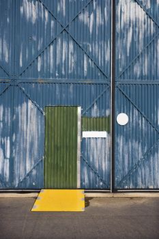Exterior of building with door and metal siding, Australia.
