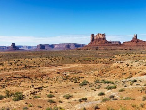 Scenic desert landscape with mountains and landforms.