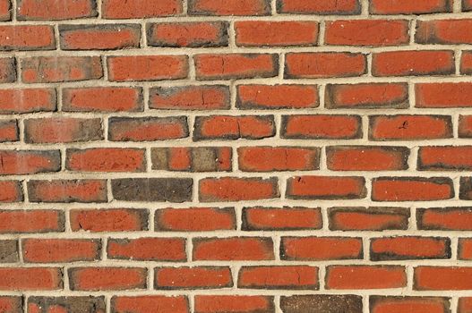 Bright and colorful brick wall with cracks - background texture