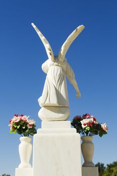 White angel sculpture in a catholic cemetery, Portugal