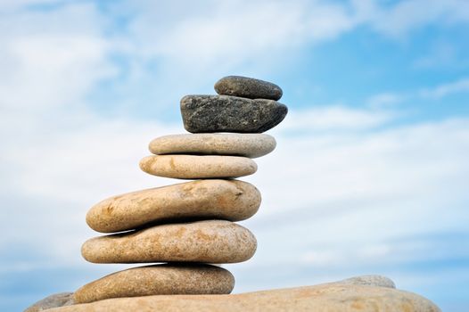 Inclined pyramid of pebbles to the sea