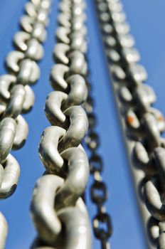 Group of chains against a blue sky