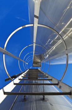 Stainless steel stairway in the tanks of a modern winery 