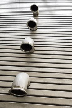 Pipes in a stainless steel metal floor 