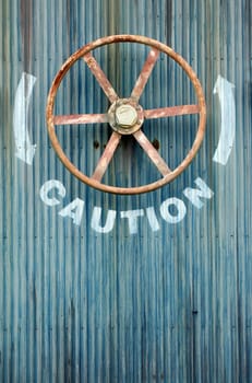 A Large wheel valve with caution