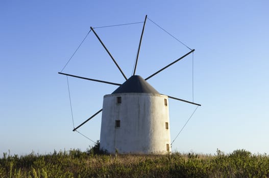 Old windmill in the top of a hill, Portugal