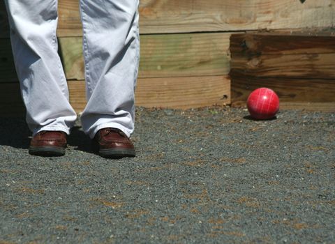 A Man playing bocce ball