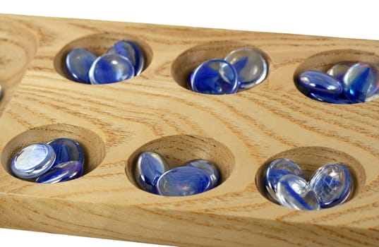 A Wooden mancala game with blue stones