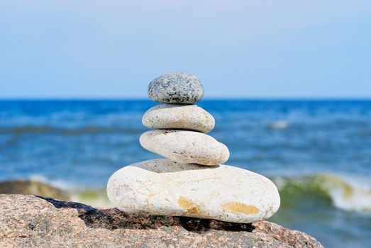 Sea stones on seacoast in sunny day