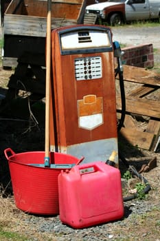 A Old rusted gas pump on a farm