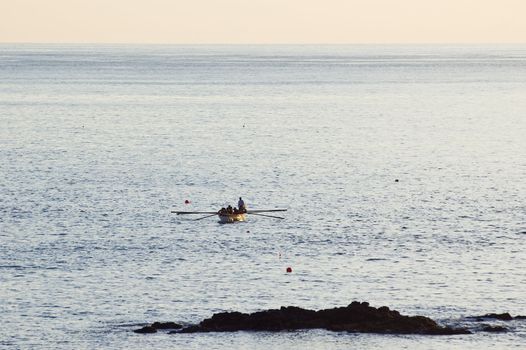 Whaler rowboat approaching, Pico island, Azores, Portugal
