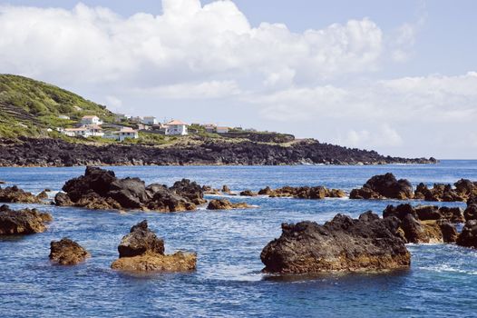 Rocky volcanic shallow coastline, Pico island, Azores, Portugal
