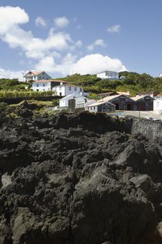 Basalt rocks beside a small  village in  Pico island, Azores, Portugal
